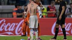 Argentina's forward Lionel Messi (L) and Curacao's goalkeeper Eloy Room exchange their jerseys at the end of the friendly football match between Argentina and Curacao at the Madre de Ciudades stadium in Santiago del Estero, in northern Argentina, on March 28, 2023. (Photo by JUAN MABROMATA / AFP)