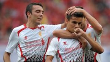 Iago Aspas felicita a Coutinho.