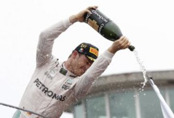 Mercedes driver Nico Rosberg, of Germany, celebrates on the podium after winning the Italian Formula One Grand Prix at the Monza racetrack, in Monza, Italy, Sunday, Sept. 4, 2016.