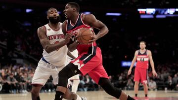 Washington Wizards center Ian Mahinmi (28) drives against New York Knicks center Kyle O&#039;Quinn (9) during the second quarter of an NBA basketball game, Thursday, April 6, 2017, in New York. (AP Photo/Julie Jacobson)