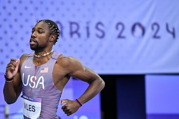 US' Noah Lyles warms up prior to the men's 200m semi-final of the athletics event at the Paris 2024 Olympic Games at Stade de France in Saint-Denis, north of Paris, on August 7, 2024. (Photo by Andrej ISAKOVIC / AFP)