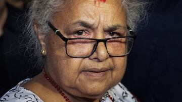 Nepal's newly sworn-in interim Prime Minister Sushila Karki arrives at a hospital to meet victims of Monday's deadly anti-corruption protests, in Kathmandu, Nepal, September 13, 2025. REUTERS/Adnan Abidi