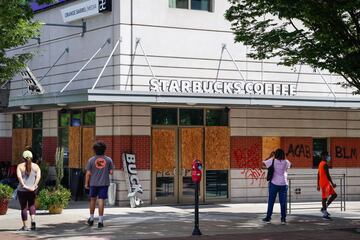 ATLANTA, GA - MAY 30: Damage is seen to a Starbucks following an overnight demonstration over the Minneapolis death of George Floyd while in police custody on May 30, 2020 in Atlanta, Georgia. Elijah Nouvelage/Getty Images/AFP == FOR NEWSPAPERS, INTERNET, TELCOS & TELEVISION USE ONLY ==