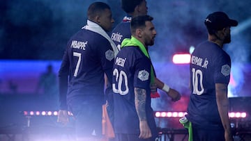 (From L) Paris Saint-Germain's French forward Kylian Mbappe, Paris Saint-Germain's Argentine forward Lionel Messi and Paris Saint-Germain's Brazilian forward Neymar leave after celebrating team's French L1 2022-2023 championship following the L1 football match between Paris Saint-Germain (PSG) and Clermont Foot 63 at the Parc des Princes Stadium in Paris on June 3, 2023. (Photo by Alain JOCARD / POOL / AFP)