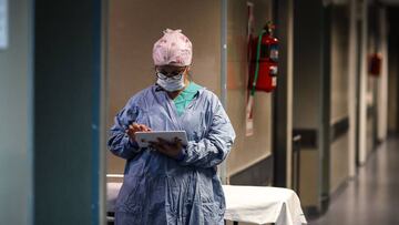 Buenos Aires (Argentina), 30/07/2020.- A doctor checks a tablet at a hallway of El Cruce de Florencio Varela Hospital in Buenos Aires, Argentina, 30 July 2020. EFE/EPA/JUAN IGNACIO RONCORONI