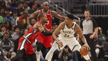 Nov 21, 2019; Milwaukee, WI, USA; Milwaukee Bucks forward Giannis Antetokounmpo (34) dribbles the ball under pressure from Portland Trail Blazers guard Rodney Hood (5) and forward Anthony Tolliver (43) during the second quarter at Fiserv Forum. Mandatory Credit: Jeff Hanisch-USA TODAY Sports
