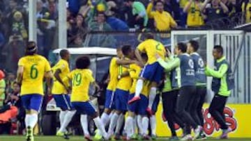 Brazil's defender Thiago Silva (covered) celebrates with teammates after scoring against Venezuela during their 2015 Copa America football championship match, in Santiago, on June 21, 2015. AFP PHOTO / MARTIN BERNETTI