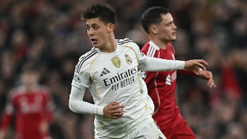 Real Madrid's Turkish midfielder #15 Arda Guler runs with the ball during the UEFA Champions League, league phase football match between Liverpool and Real Madrid at Anfield in Liverpool, north west England on November 4, 2025. (Photo by Paul ELLIS / AFP)