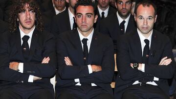 Puyol, Xavi e Iniesta.