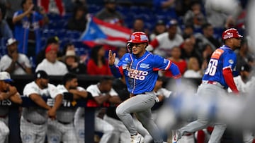 Puerto Rico's outfielder Bryan Torres runs to home base during the Caribbean Series baseball game between Panama and Puerto Rico at LoanDepot Park in Miami, Florida, on February 5, 2024. (Photo by Chandan Khanna / AFP)