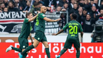 30 April 2022, Baden-Wuerttemberg, Stuttgart: Soccer: Bundesliga, VfB Stuttgart - VfL Wolfsburg, Matchday 32, Mercedes-Benz Arena. Wolfsburg's John Anthony Brooks (center) celebrates with Wolfsburg's Max Kruse (l) and Wolfsburg's Ridle Baku (r) after scoring the 0:1 goal. Photo: Tom Weller/dpa - IMPORTANT NOTE: In accordance with the requirements of the DFL Deutsche Fußball Liga and the DFB Deutscher Fußball-Bund, it is prohibited to use or have used photographs taken in the stadium and/or of the match in the form of sequence pictures and/or video-like photo series. (Photo by Tom Weller/picture alliance via Getty Images)