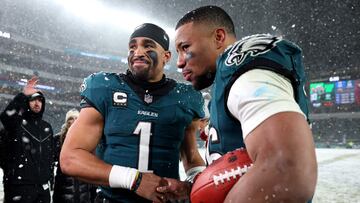 PHILADELPHIA, PENNSYLVANIA - JANUARY 19: (L-R) Jalen Hurts #1 and Saquon Barkley #26 of the Philadelphia Eagles react after defeating the Los Angeles Rams 28-22 in the NFC Divisional Playoff at Lincoln Financial Field on January 19, 2025 in Philadelphia, Pennsylvania. Sarah Stier/Getty Images/AFP (Photo by Sarah Stier / GETTY IMAGES NORTH AMERICA / Getty Images via AFP)