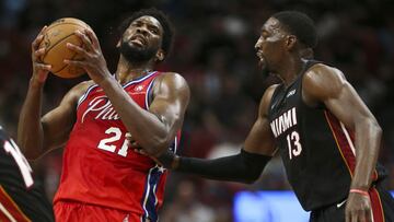 Mar 5, 2022; Miami, Florida, USA; Philadelphia 76ers center Joel Embiid (21) controls the ball against Miami Heat center Bam Adebayo (13) during the third quarter at FTX Arena. Mandatory Credit: Sam Navarro-USA TODAY Sports