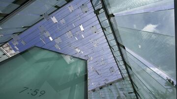 The 9/11 memorial stands at Logan International Airport, on Thursday, Aug. 19, 2021, in Boston. Tucked in a grove of ginkgo trees, the glass cube at Logan Airport pays tribute to those lost aboard the two jetliners that took off from Boston and were hijac