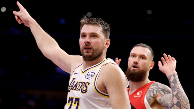 LOS ANGELES, CALIFORNIA - JANUARY 18: Luka Doncic #77 of the Los Angeles Lakers reacts after a play against Sandro Mamukelashvili #54 of the Toronto Raptors during the third quarter at Crypto.com Arena on January 18, 2026 in Los Angeles, California. NOTE TO USER: User expressly acknowledges and agrees that, by downloading and or using this photograph, User is consenting to the terms and conditions of the Getty Images License Agreement. Katelyn Mulcahy/Getty Images/AFP (Photo by Katelyn Mulcahy / GETTY IMAGES NORTH AMERICA / Getty Images via AFP)