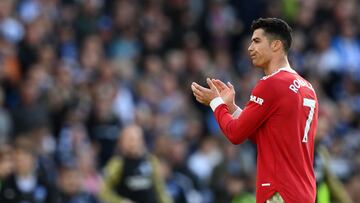 Manchester United's Portuguese striker Cristiano Ronaldo applauds supporters on the pitch after the English Premier League football match between Brighton and Hove Albion and Manchester United at the American Express Community Stadium in Brighton, southern England on May 7, 2022. - Brighton won the game 4-0. (Photo by Glyn KIRK / AFP) / RESTRICTED TO EDITORIAL USE. No use with unauthorized audio, video, data, fixture lists, club/league logos or 'live' services. Online in-match use limited to 120 images. An additional 40 images may be used in extra time. No video emulation. Social media in-match use limited to 120 images. An additional 40 images may be used in extra time. No use in betting publications, games or single club/league/player publications. / 