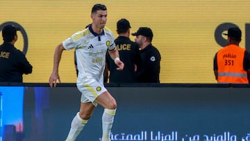 Nassr's Portuguese forward #7 Cristiano Ronaldo runs with the ball during the Saudi Pro League football match between Al-Nassr and Al-Khaleej at Al-Awwal Park in Riyadh on May 21, 2025. (Photo by Fayez NURELDINE / AFP)
