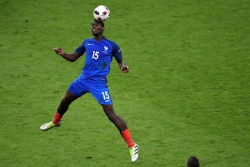 France's midfielder Paul Pogba heads the ball during the Euro 2016 final football match between Portugal and France at the Stade de France in Saint-Denis, north of Paris, on July 10, 2016.