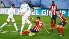 FILE PHOTO: Soccer Football - La Liga Santander - Real Madrid v Atletico Madrid - Estadio Alfredo Di Stefano, Madrid, Spain - December 12, 2020 Real Madrid&#039;s Karim Benzema in action with Atletico Madrid&#039;s Renan Lodi REUTERS/Juan Medina/File Phot