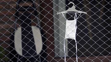 A face mask hangs to dry in a balcony during the lockdown imposed by the government against the spread of the new coronavirus, COVID-19, in Buenos Aires, Argentina, on April 21, 2020. (Photo by JUAN MABROMATA / AFP)