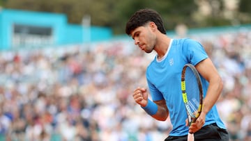 Spain's Carlos Alcaraz reacts after winning a point against Argentina's Sebastian Baez during the Monte Carlo ATP Masters Series Tournament round of 64 tennis match on Court Rainier III at the Monte-Carlo Country Club in Roquebrune-Cap-Martin, south-eastern France on April 7, 2026. (Photo by Valery HACHE / AFP)