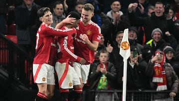 Manchester United's Ivorian midfielder #16 Amad Diallo (C) celebrates scoring the team's third goal, his hat-trick, with Manchester United's Argentinian midfielder #17 Alejandro Garnacho (L) during the English Premier League football match between Manchester United and Southampton at Old Trafford in Manchester, north west England, on January 16, 2025. (Photo by Oli SCARFF / AFP) / RESTRICTED TO EDITORIAL USE. No use with unauthorized audio, video, data, fixture lists, club/league logos or 'live' services. Online in-match use limited to 120 images. An additional 40 images may be used in extra time. No video emulation. Social media in-match use limited to 120 images. An additional 40 images may be used in extra time. No use in betting publications, games or single club/league/player publications. /