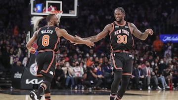 Dec 25, 2021; New York, New York, USA;  New York Knicks forward Julius Randle (30) is greeted by congratulated by guard Kemba Walker (8) after making a three point shot in the third quarter against the Atlanta Hawks at Madison Square Garden. Mandatory Credit: Wendell Cruz-USA TODAY Sports