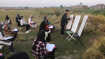 Srinagar (India), 01/07/2020.- Kashmiri Muslim students attend an outdoor class at Eidgah ground in downtown Srinagar, Kashmir, 01 July 2020. At sunrise, while maintaining social distance, local community members teach classes to compensate for the shutdo