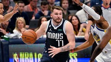 Mar 22, 2023; Dallas, Texas, USA; Dallas Mavericks guard Luka Doncic (77) drives to the basket against the Golden State Warriors during the second half at the American Airlines Center. Mandatory Credit: Jerome Miron-USA TODAY Sports