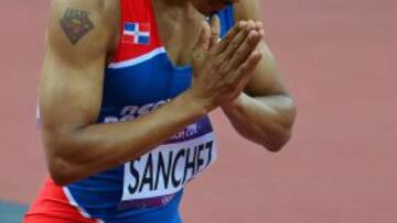 Dominican Republic's Felix Sanchez celebrates after competing in the men's 400m hurdles semifinals at the athletics event of the London 2012 Olympic Games on August 4, 2012 in London. AFP PHOTO / GABRIEL BOUYS