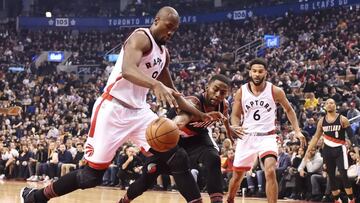 Toronto Raptors forward Serge Ibaka (9) strips the ball from Portland Trail Blazers forward Maurice Harkless (4) during first-half NBA basketball game action in Toronto, Sunday, Feb. 26, 2017. (Frank Gunn/The Canadian Press via AP)