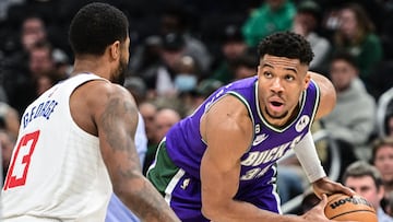 Feb 2, 2023; Milwaukee, Wisconsin, USA; Milwaukee Bucks forward Giannis Antetokounmpo (34) looks to get around Los Angeles Clippers forward Paul George (13) in the third quarter at Fiserv Forum. Mandatory Credit: Benny Sieu-USA TODAY Sports