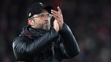 Liverpool&#039;s German manager Jurgen Klopp applauds supporters on the pitch after the English Premier League football match between Liverpool and Leicester City at Anfield in Liverpool, north west England on January 30, 2019. - The game finished 1-1. (P