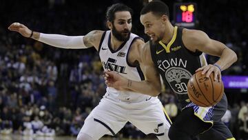 Golden State Warriors' Stephen Curry, right, drives as Utah Jazz guard Ricky Rubio defends during the second half of an NBA basketball game Tuesday, Feb. 12, 2019, in Oakland, Calif. (AP Photo/Ben Margot)