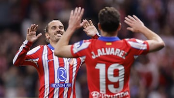 Atletico Madrid's Argentine forward #19 Julian Alvarez celebrates with Atletico Madrid's French forward #07 Antoine Griezmann scoring his team's third goal during the Spanish league football match between Club Atletico de Madrid and Rayo Vallecano de Madrid at the Metropolitano Stadium in Madrid, on April 24, 2025. (Photo by OSCAR DEL POZO / AFP)
