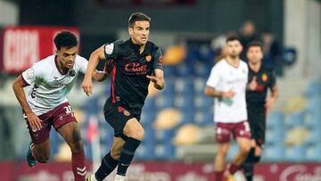 PONTEVEDRA, SPAIN - JANUARY 04:  Alex Masogo of Pontevedra CF competes for the ball with Anigo Ruiz de Galarreta of RCD Mallorca during the Copa del Rey Round of 32 match between Pontevedra CF and RCD Mallorca at Estadio Municipal de Pasaron on January 04, 2023 in Pontevedra, Spain. (Photo by Jose Manuel Alvarez/Quality Sport Images/Getty Images)