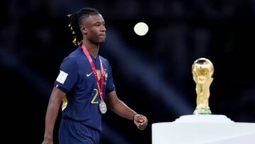 LUSAIL CITY, QATAR - DECEMBER 18: Eduardo Camavinga of France looks dejected as they walk past the FIFA World Cup Qatar 2022 Winner's Trophy after the team's defeat during the FIFA World Cup Qatar 2022 Final match between Argentina and France at Lusail Stadium on December 18, 2022 in Lusail City, Qatar. (Photo by Maja Hitij - FIFA/FIFA via Getty Images)