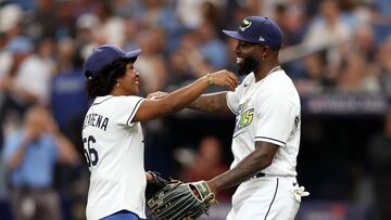 ST PETERSBURG, FLORIDA - OCTOBER 03: Randy Arozarena #56 of the Tampa Bay Rays hugs his mother, Sandra Gonzalez, after her ceremonial first pitch prior to during Game One of the Wild Card Series between the Tampa Bay Rays and the Texas Rangers at Tropicana Field on October 03, 2023 in St Petersburg, Florida.   Megan Briggs/Getty Images/AFP (Photo by Megan Briggs / GETTY IMAGES NORTH AMERICA / Getty Images via AFP)