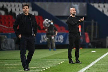 First leg | Manchester City's Spanish manager Pep Guardiola gives his instructions next to Paris Saint-Germain's Argentinian head coach Mauricio Pochettino.