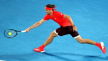 Germany's Alexander Zverev hits a return against France's Lucas Pouille during their men's singles match on day one of the Australian Open tennis tournament in Melbourne on January 12, 2025. (Photo by Martin KEEP / AFP) / -- IMAGE RESTRICTED TO EDITORIAL USE - STRICTLY NO COMMERCIAL USE --