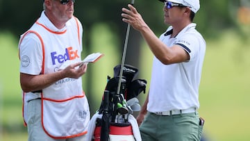 MEMPHIS, TENNESSEE - AUGUST 11: Kurt Kitayama of the United States and his caddie Tim Tucker wait to play a shot on the 10th hole during the second round of the FedEx St. Jude Championship at TPC Southwind on August 11, 2023 in Memphis, Tennessee.   Andy Lyons/Getty Images/AFP (Photo by ANDY LYONS / GETTY IMAGES NORTH AMERICA / Getty Images via AFP)
