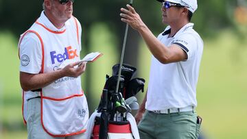 MEMPHIS, TENNESSEE - AUGUST 11: Kurt Kitayama of the United States and his caddie Tim Tucker wait to play a shot on the 10th hole during the second round of the FedEx St. Jude Championship at TPC Southwind on August 11, 2023 in Memphis, Tennessee.   Andy Lyons/Getty Images/AFP (Photo by ANDY LYONS / GETTY IMAGES NORTH AMERICA / Getty Images via AFP)