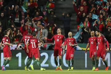 Portugal's player Andre Silva celebrates with his teammates after scoring a goal during the 2018 FIFA World Cup Russia group B qualifying soccer match