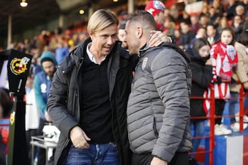 José María Gutiérrez (left) greets Lugo coach Curro Torres before Almería's Segunda División clash with the Galicians.