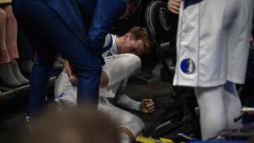 Dec 14, 2019; Dallas, TX, USA; Dallas Mavericks forward Luka Doncic (77) is looked at by trainers during the first quarter against the Miami Heat at the American Airlines Center. Mandatory Credit: Jerome Miron-USA TODAY Sports