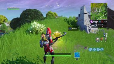 Desafío de Fortnite - Busca entre un hombre de roca gigante, un tomate coronado y un árbol cercado