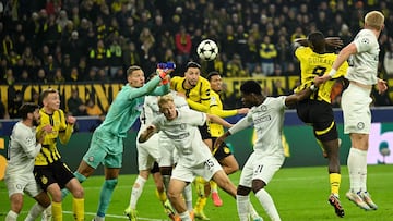 Sturm Graz's Dutch goalkeeper #01 Kjell Scherpen (C) punches the ball clear during the UEFA Champions League football match BVB Borussia Dortmund vs SK Sturm Graz in Dortmund, western Germany on November 5, 2024. (Photo by INA FASSBENDER / AFP)