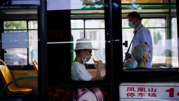 People wearing face masks are seen on a bus following the coronavirus disease (COVID-19) outbreak in Wuhan, Hubei province, China September 3, 2020. REUTERS/Aly Song