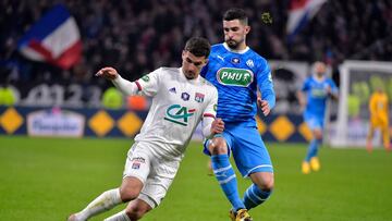 Lyon's French midfielder Houssem Aouar (L) vies with Marseille's Spanish defender Alvaro Gonzalez during the French Cup quarter-final football match between Olympique Lyonnais and Olympique de Marseille at the Groupama stadium in Decines-Charpie