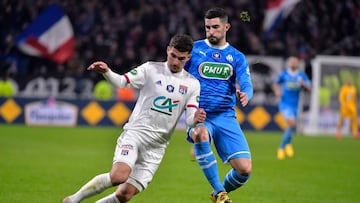 Lyon&#039;s French midfielder Houssem Aouar (L) vies with Marseille&#039;s Spanish defender Alvaro Gonzalez during the French Cup quarter-final football match between Olympique Lyonnais and Olympique de Marseille at the Groupama stadium in Decines-Charpie